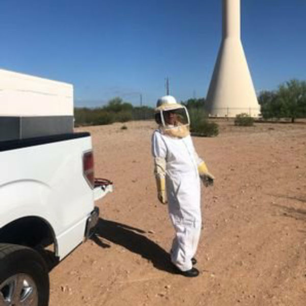 man in beekeepers outfit